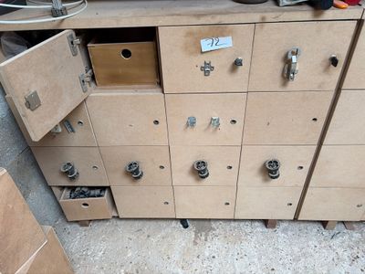 a cabinet that has a bunch of drawers inside of it