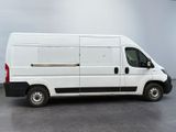 a picture of a white van parked in a room