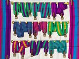 an image of a multicolored scarf hanging on a wall