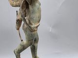 an image of a statue of an angel with wings on top of a ball