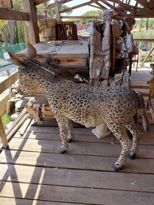 a statue of a giraffe that is standing on a porch