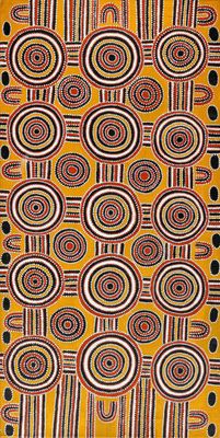 a yellow and black rug with circles and dots on it