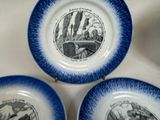 three blue and white plates with a picture of a man and a woman on them