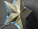 an image of a glass star on a black background