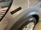 a close up of a car that has a sticker on it
