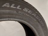 a close up of a tire with the words all season written on it