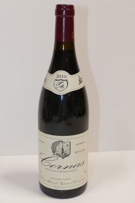 a bottle of wine that is sitting on a table