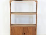 a wooden shelf with a clock on top of it