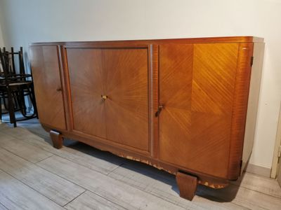 a wooden cabinet that is sitting on a wooden floor