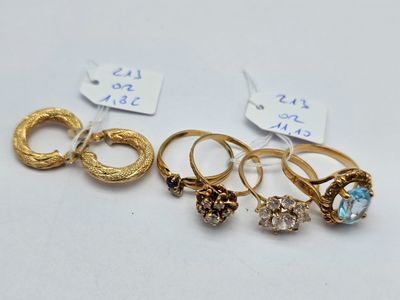 a group of five gold rings and a diamond ring