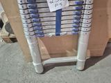a stack of ladders with a sticker on it