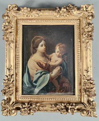 une image d'un tableau représentant une femme tenant un enfant dans ses bras