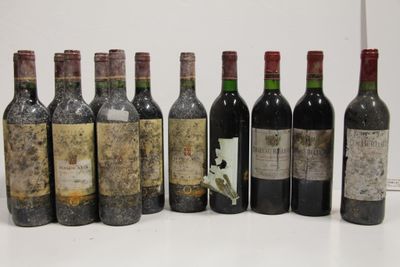 several bottles of wine are lined up in a row on a table