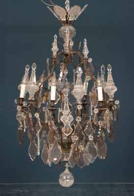 a crystal chandelier hanging from the ceiling in a room