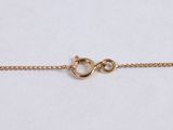 a gold chain bracelet with a clasp on a white background