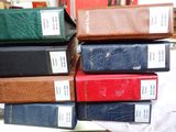 several books are stacked on top of each other on a table