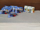 a lot of legos on a bed with a wooden headboard