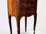 a small wooden table with a drawer on it