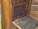 a small oven sitting on top of a wooden table