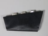 a black purse that is hanging on the wall