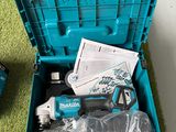 a blue tool box with tools in it on the floor
