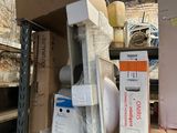 many boxes and boxes on a shelf in a room