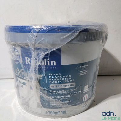a tub of toilet paper wrapped in plastic on a counter