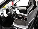 the interior of a small car with two seats and a steering wheel