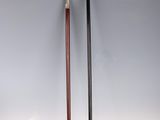 pair of walking canes on a white background