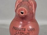 a ceramic pig that is sitting on a table