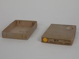 two boxes that are sitting next to each other on a table