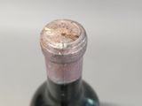 a bottle of wine with a cork on the top of it