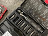 a tool kit that is sitting on the floor
