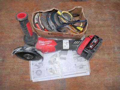 a box of assorted tools on a wooden table