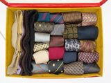 a box full of different types of ties in it