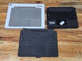 two laptops that are sitting on a wooden table