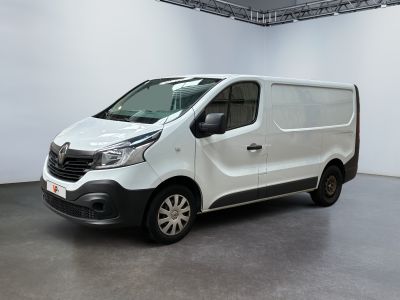 the white van is parked in a large room with white walls