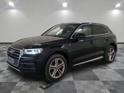 the black audi suv is parked on a checkered tile floor