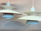 two lamps hanging from the ceiling of a room