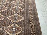 an image of a large oriental rug on a wooden floor
