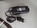 a charger that is sitting on a table next to a cord