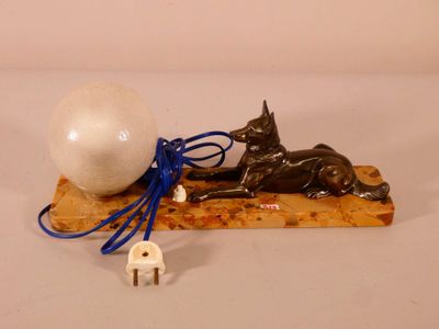 an image of a cat and a ball on a wooden board