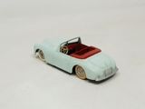 a toy car that is sitting on a white surface