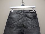 the back of a pair of jeans hanging on a hanger