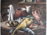 a painting of a fish on a table with other items