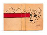 un livre ouvert sur lequel est dessiné un guépard