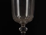 a wine glass sitting on top of a table