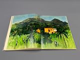 an open book with a picture of a house in the middle of it