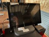 a laptop computer sitting on top of a desk