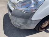 a white van that is parked in a parking lot
